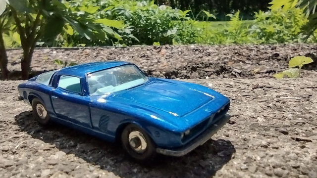 Matchbox Iso Grifo blue sports car in sunny yard