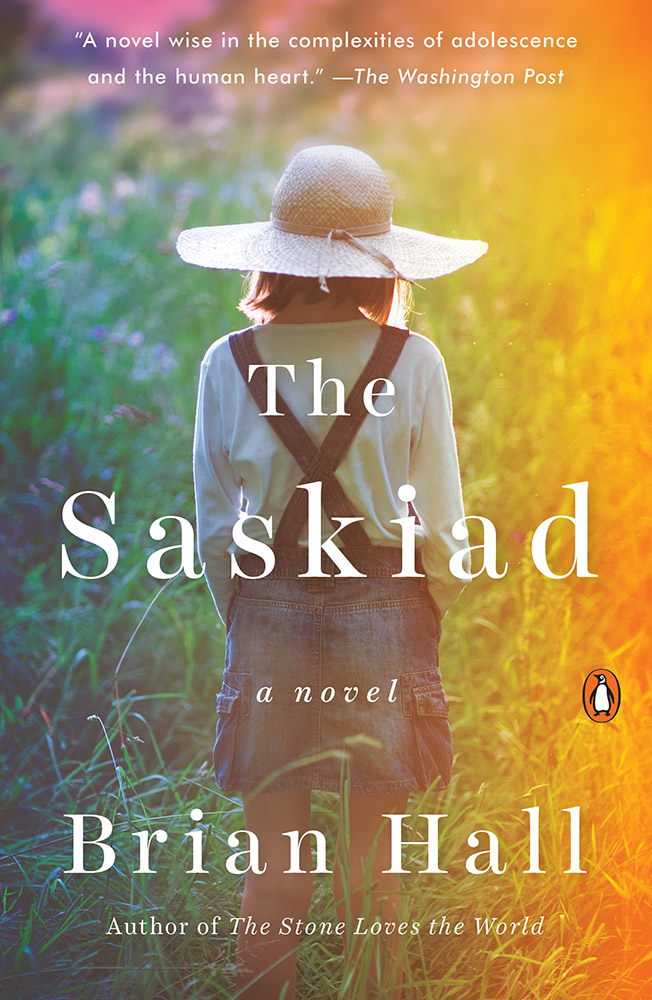 Front cover of "The Sasklad" with image of a preteen girl in a thoughtful pose surrounded by meadow grass lit with warm colors
